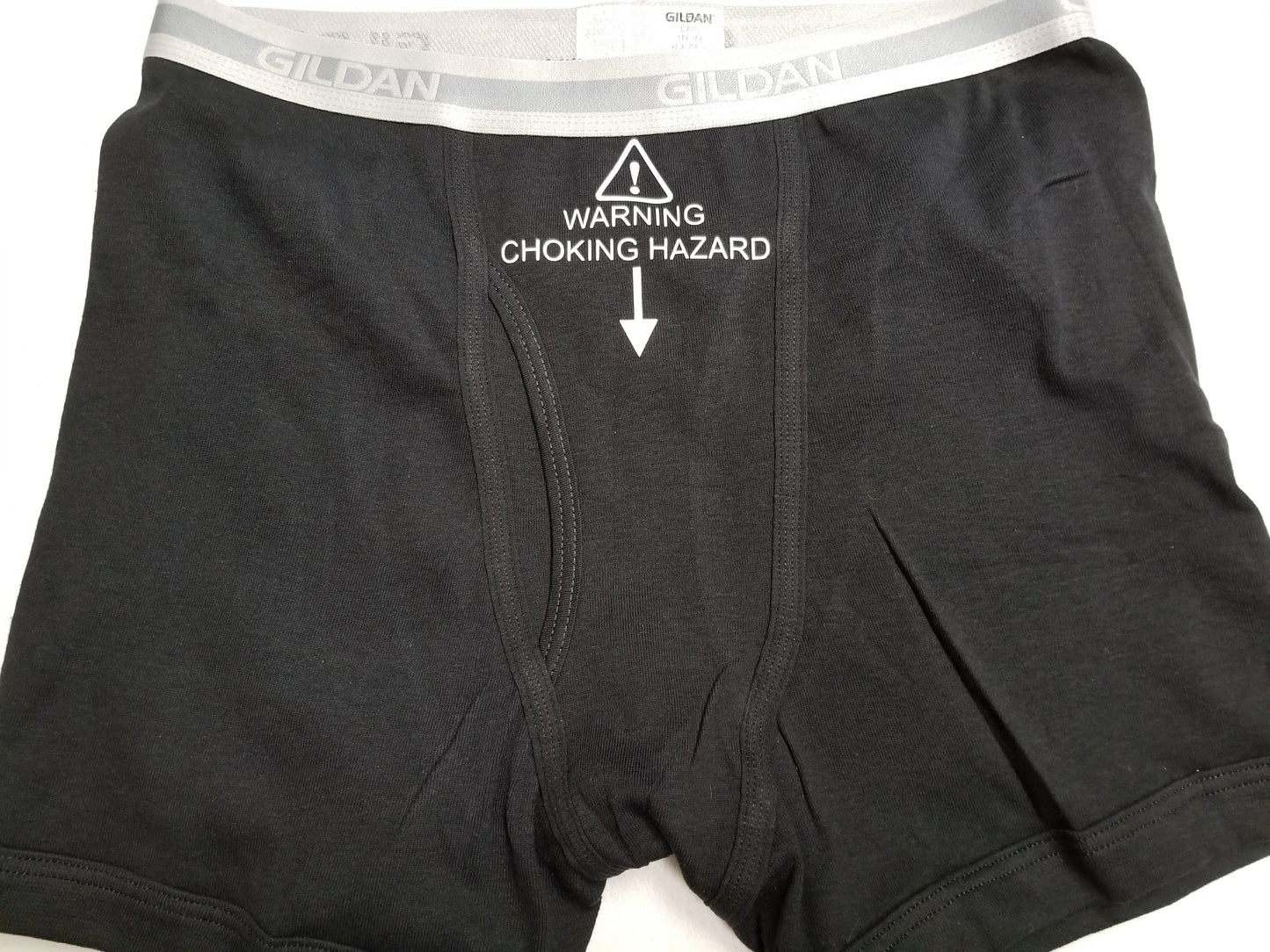 Underwear with “WARNING: CHOKING HAZARD” label in black boxer briefs
Funny gag gift underwear – choking hazard symbol design
Black and grey men’s boxers and briefs with warning print