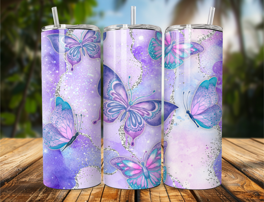"Beautiful tumbler with a purple agate and glitter background featuring butterflies in purple, teal, and pink. Available in 20oz or 30oz sizes."