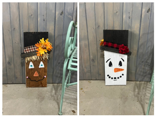 Two decorative signs featuring a scarecrow and a snowman, one with a black hat and the other with a white hat, both with fall-themed decorations.