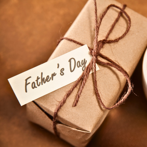 Father’s Day gift box with funny shirt, snacks, tools, and novelty items”