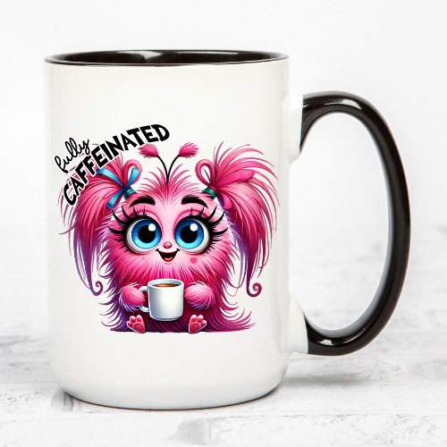 Double-sided coffee mug showing before and after caffeine monster designs.