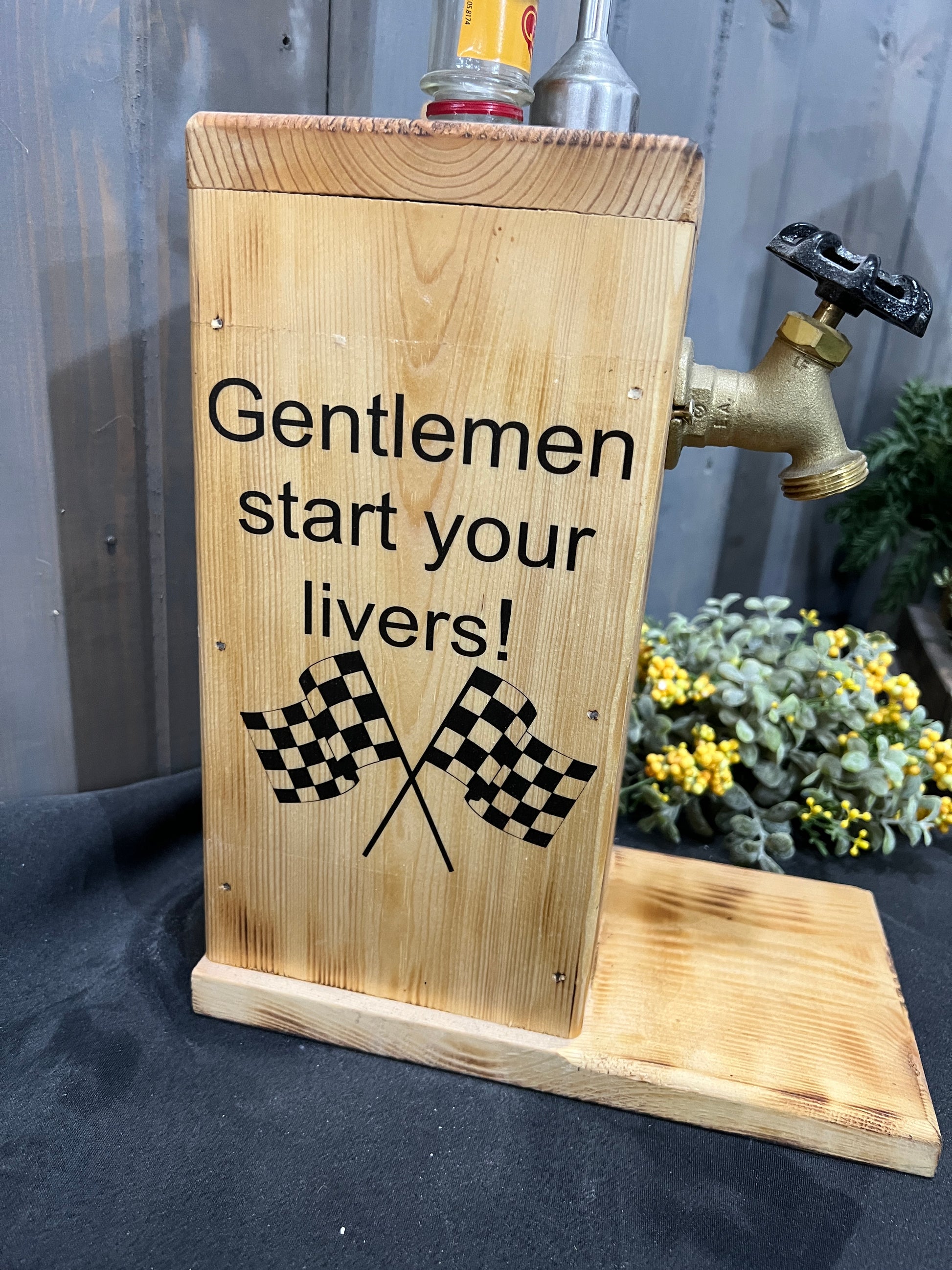 Close-up of double-sided racing design on Fireball liquor dispenser.