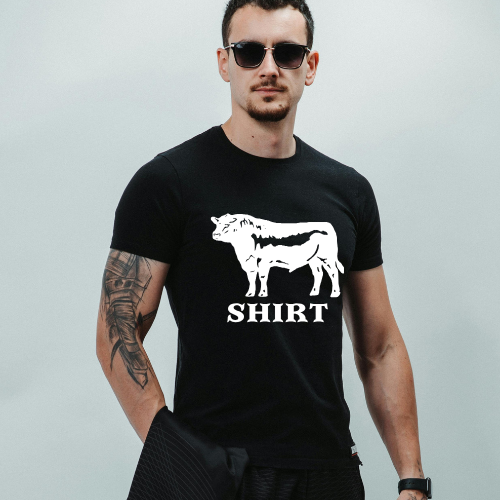 Close-up of pun graphic tee with bull and SHIRT text.