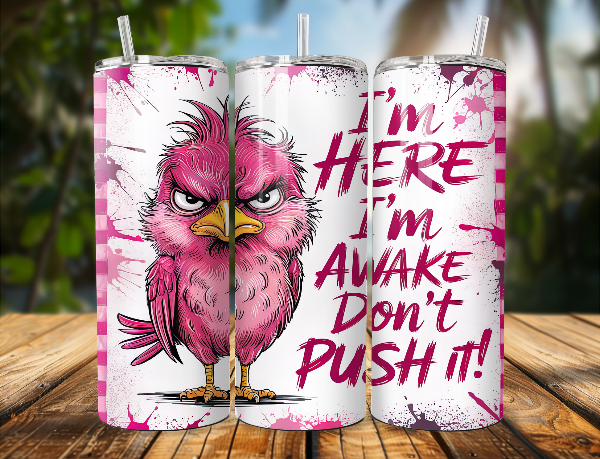 Tumbler with an angry pink bird and the phrase “I’m Here I’m Awake Don’t Push It” printed on it.