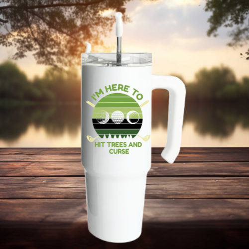 White golf-themed handled tumbler with the phrase "I'm here to hit trees and curse" featuring golf balls and clubs.