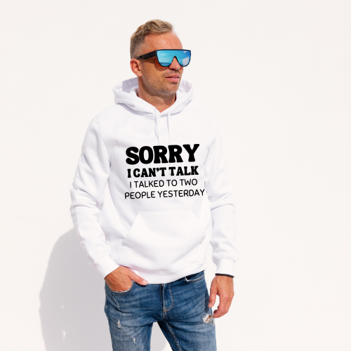 Man wearing a white hoodie with text, sunglasses, and jeans on a white background