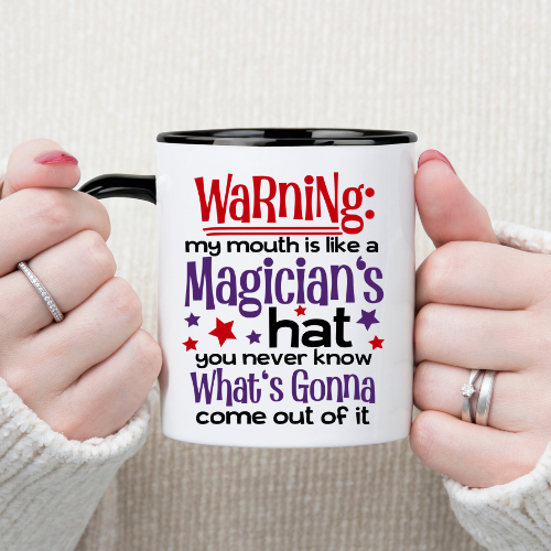 15 oz white mug with ‘Warning: my mouth is like a magician’s hat’ quote, red handle.