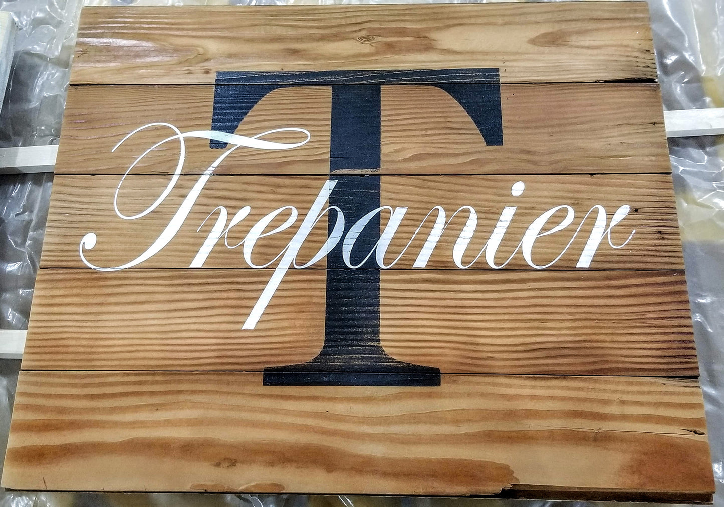 Reclaimed wood monogram sign with rustic imperfections