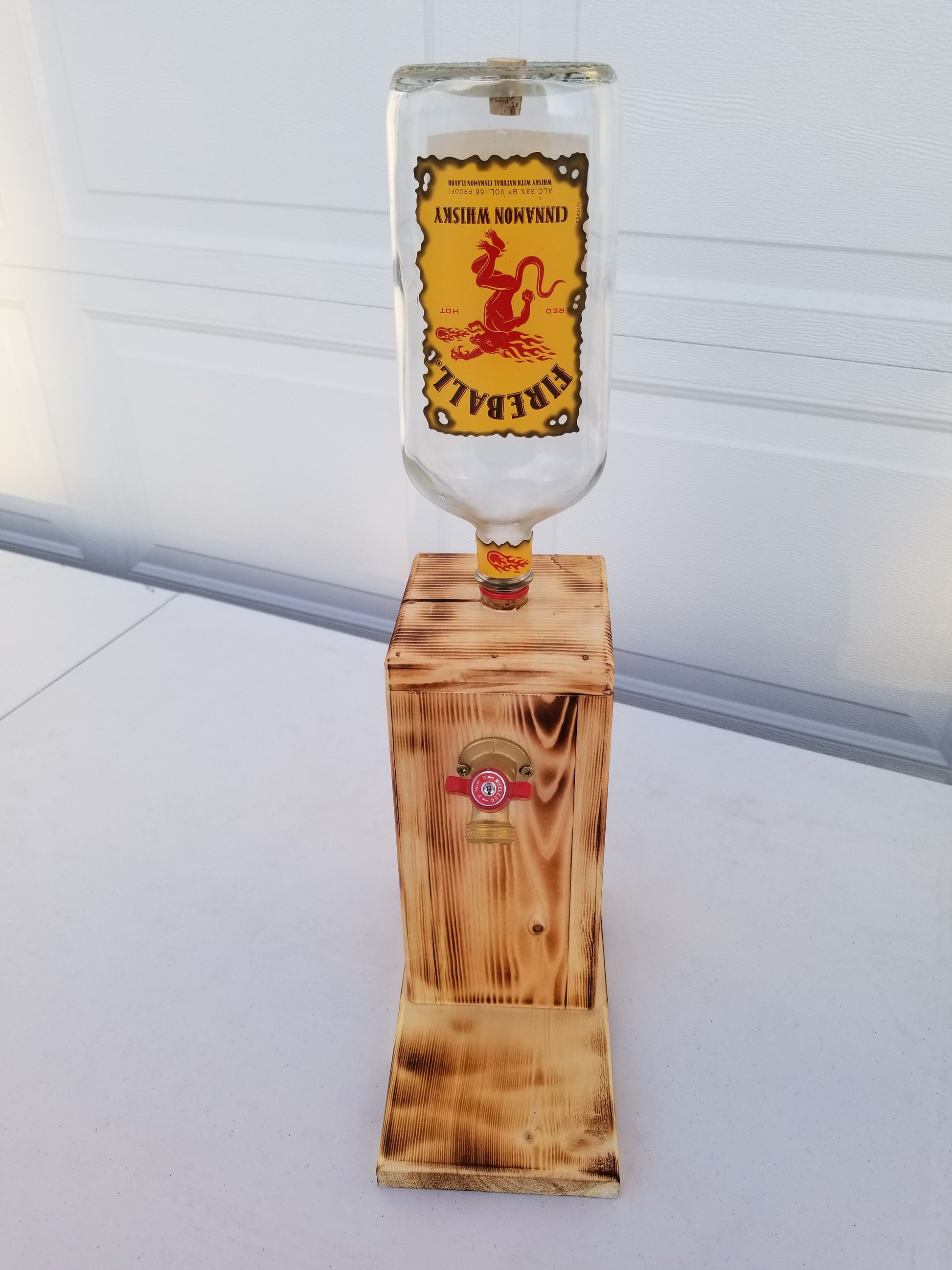 Fireball dispenser measuring 22 inches tall, 10 inches deep, 6 inches wide.