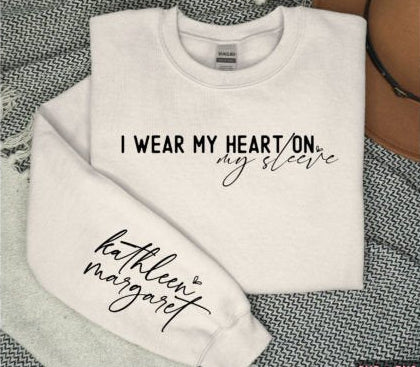 Custom family sweatshirt with I Wear My Heart on My Sleeve design and personalized names.