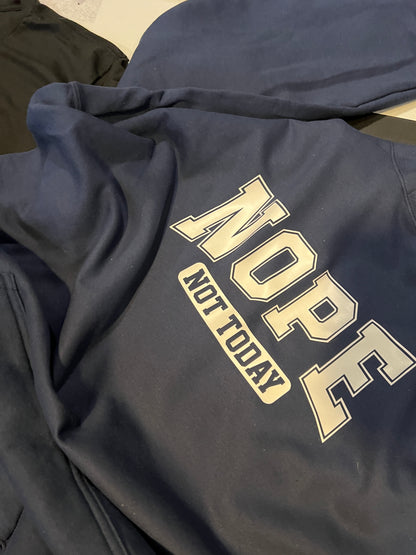 Navy blue sweatshirt with 'NOPE NOT TODAY' text in gold on a neutral background