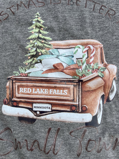 Decorative graphic of a truck with Christmas elements on a gray background