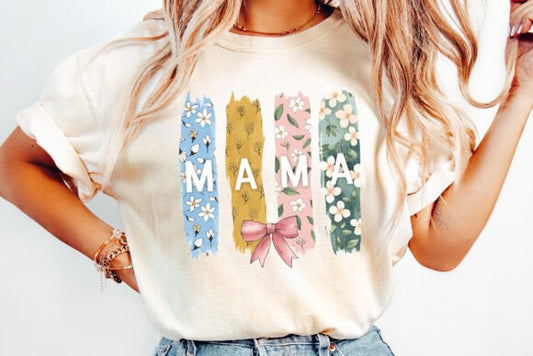 Cream shirt or sweatshirt with “MAMA” printed over four different floral background panels in soft, stylish patterns.