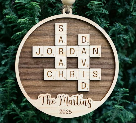 Wooden round crossword name ornament with engraved family name and year