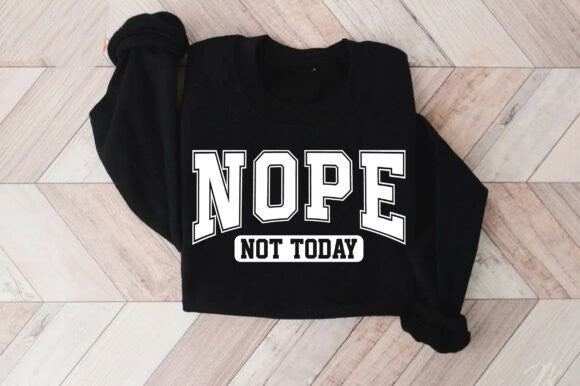Black sweatshirt with 'NOPE NOT TODAY' text on a wooden floor