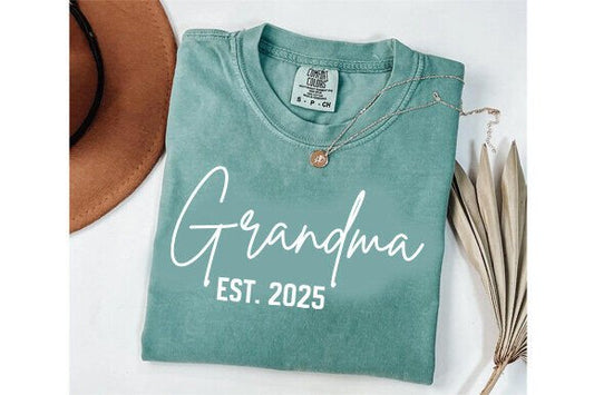 Cream-colored crewneck sweatshirt that says “Grandma Est.” with a customizable year in elegant lettering.