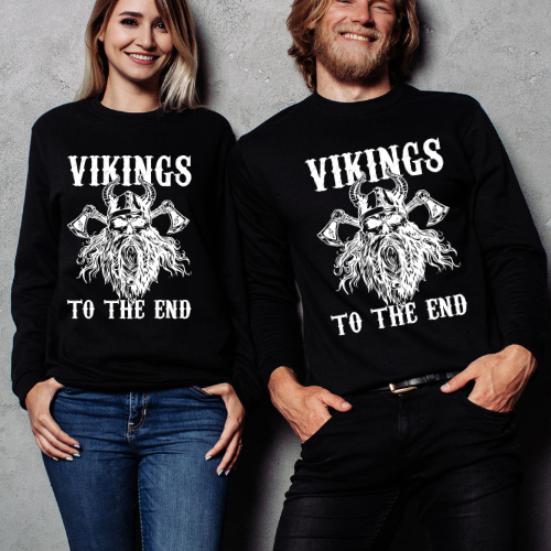 Two people wearing black sweatshirts with 'Vikings to the End' design on a gray background