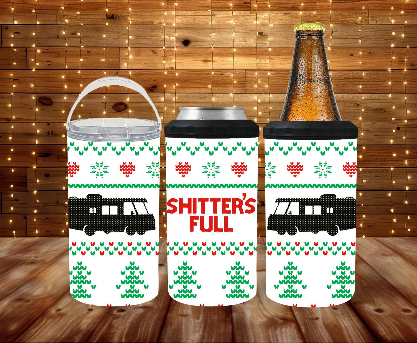 Three can coolers with Christmas-themed designs and a bottle on a wooden surface.