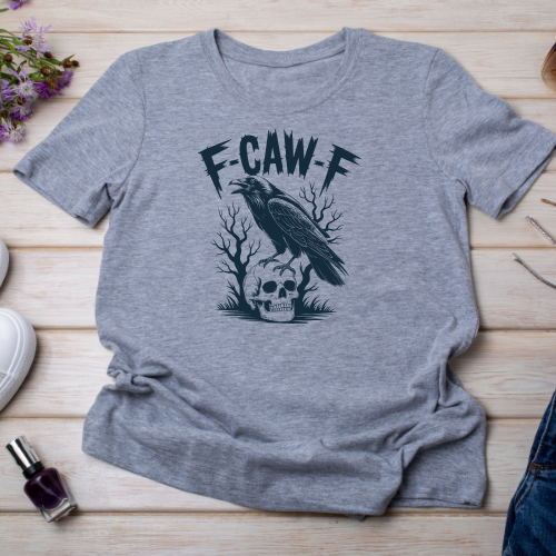 Close-up of crow perched on skull design with F-CAW-F text