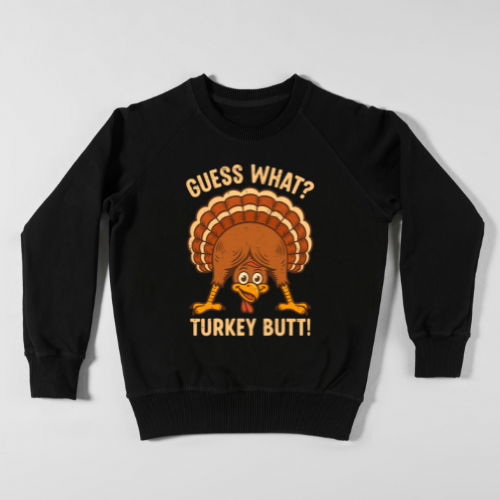 Cartoon turkey looking through his legs with the phrase “Guess What? Turkey Butt!” printed on a fall-themed shirt.