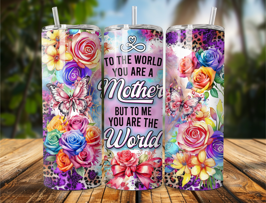 Tumbler with purple, yellow, and pink flowers, butterflies, and leopard print with the quote “To the world you are a Mother, but to me you are the world.”