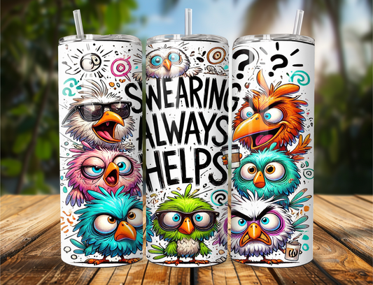 Three colorful owl-themed tumblers on a wooden surface with a blurred natural background.