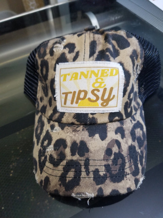 Women’s messy bun hat with Tanned & Tipsy design