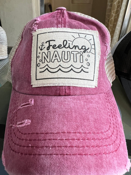 Distressed maroon ponytail hat with Feeling Nauti anchor patch